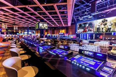 a casino with a bunch of tables and chairs at Riversuites At The Battery in Philadelphia