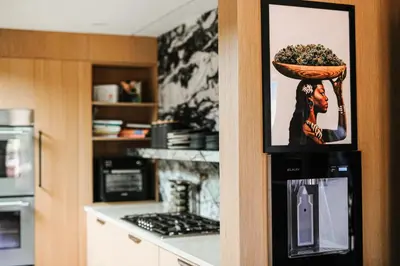 a picture of a woman with a bowl of food on a wall at Stunning Villa in Princeton, NJ in Princeton