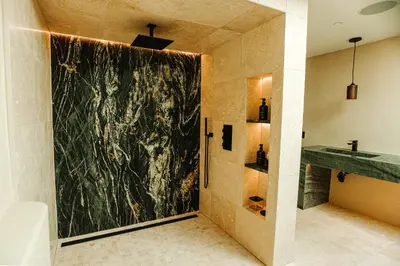 a bathroom with a shower with a large painting on the wall at Stunning Villa in Princeton, NJ in Princeton