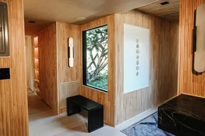 a room with wooden walls and a window and a bench at Stunning Villa in Princeton, NJ in Princeton