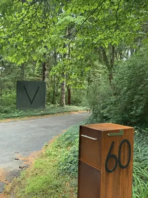 a wooden box sitting on the side of a road at Stunning Villa in Princeton, NJ in Princeton
