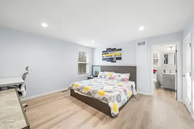 a bedroom with a bed and a desk at Big Villa,4 Masters, Heated Pool, Hot Tub, Sauna in Blakeslee