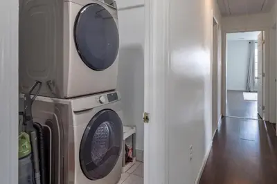 a washing machine and a dryer in a room at Huge 3BR Urban Gem just 3 miles to NYC plus Free Parking in Jersey City