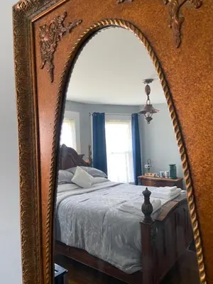 a large mirror in a bedroom with a bed at Elizabeth New Jersey bedroom -Newark Airport -New York City in Elizabeth