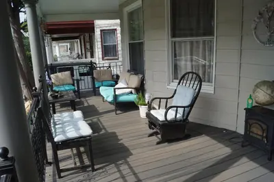 a porch with chairs and a fireplace on a house at Elizabeth New Jersey bedroom -Newark Airport -New York City in Elizabeth
