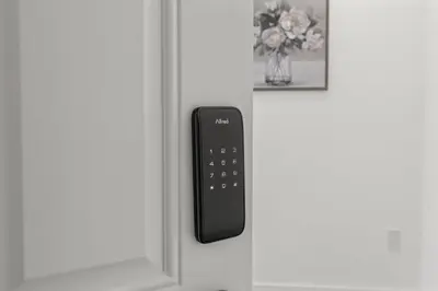 a remote control on the door of a refrigerator at New Season Royals, Airport West in Chester