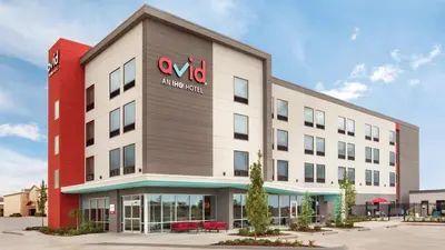 an office building with a va hospital sign on it at avid hotel Harrisburg NE - Hershey Area by IHG in Harrisburg