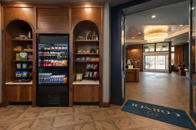 a drink station in a restaurant with a refrigerator at Hotel Indigo West Chester - Downtown by IHG in West Chester