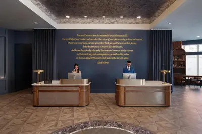 two people sitting at computers in a lobby at Hotel Indigo West Chester - Downtown by IHG in West Chester