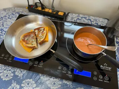 a frying pan with toast on a stove with a cup of coffee at Idea Farm in Callicoon Center