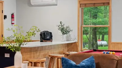 a living room with a pool table and a bar at Bluejay Getaway by AvantStay Private Lake Cabin • Hot Tub Game Room Walk to Lake in Albrightsville