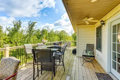 a patio with a table and chairs on a deck at Harrisburg Retreat with 8 Mi to Hersheypark in Harrisburg