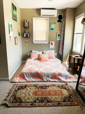 a bedroom with a bed and a rug at MASSiVE Bohemian Oasis in Philly 5 Bdrm Sleeps 12 in Philadelphia