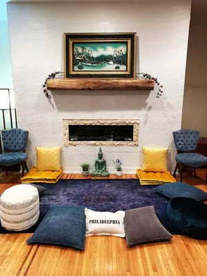 a living room with a fireplace and a blue rug at MASSiVE Bohemian Oasis in Philly 5 Bdrm Sleeps 12 in Philadelphia
