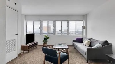 a living room with a couch and a tv at PP 1009 Beautiful Corporate 2br Apt, Pool in Harrisburg