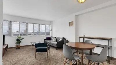 a living room with a couch and a table at PP 1009 Beautiful Corporate 2br Apt, Pool in Harrisburg