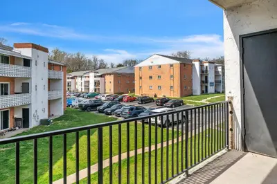a balcony with a view of a parking lot at Spacious Retreat I Balcony I Parking I Chateau in Wilmington