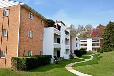 a large brick building with an american flag on it at Luxurious 2-bedroom Apartment In Wilmington in Wilmington