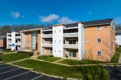 an apartment building with a parking lot at Luxurious 2-bedroom Apartment In Wilmington in Wilmington