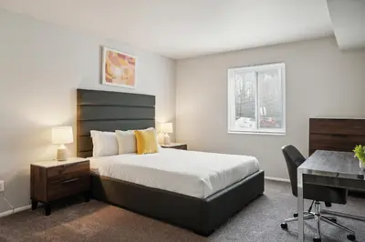 a bedroom with a bed and a desk and a computer at Chateau 506 Stunning In Wilmington, Free Parking! in Wilmington
