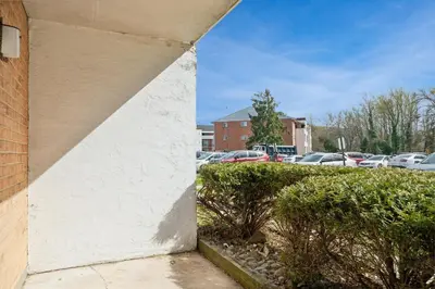 a corner of a building next to a parking lot at Chateau 506 Stunning In Wilmington, Free Parking! in Wilmington