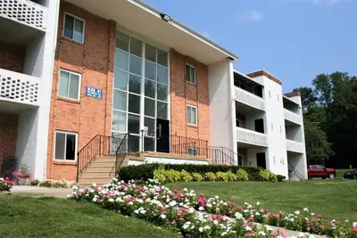 an apartment building with flowers in front of it at Chateau 506 Stunning In Wilmington, Free Parking! in Wilmington