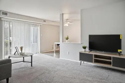 a living room with a large flat screen tv at Chateau 506 Stunning In Wilmington, Free Parking! in Wilmington