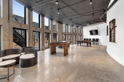 a large room with tables and chairs and windows at Royal Oasis Indoor Pool, FREE Parking, Near NYC in Elizabeth