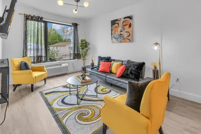 a living room with a couch and two chairs at Royal Oasis Indoor Pool, FREE Parking, Near NYC in Elizabeth