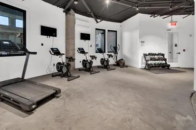 a gym with several exercise equipment in a room at Pink Heaven Indoor Pool, FREE Parking, Near NYC in Elizabeth