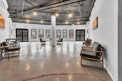 a large room with chairs and paintings on the walls at Pink Heaven Indoor Pool, FREE Parking, Near NYC in Elizabeth