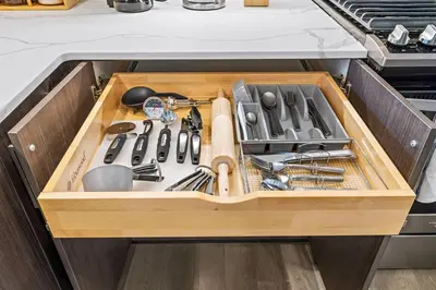 a drawer in a kitchen filled with utensils at Cozy Stylish retreat - NYC & NWK w free parking in Bayonne