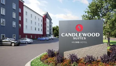 a sign in front of a building at Candlewood Suites Pittston by IHG in Pittston