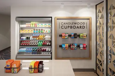 a canadian supermarket with a refrigerator filled with drinks at Candlewood Suites Pittston by IHG in Pittston