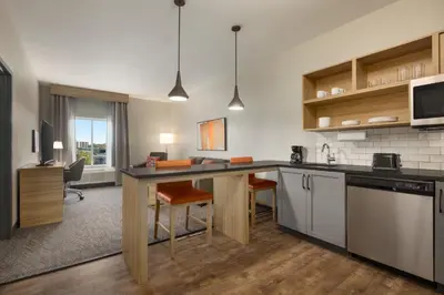 a kitchen with a large island in a room at Candlewood Suites Pittston by IHG in Pittston
