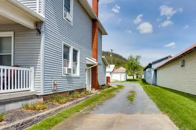 an empty street between two houses at Amish Country Townhome Near Hiking and Fly Fishing! in Loganton