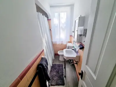 a small bathroom with a sink and a toilet at 1 Bedroom 1 Bath Apartment In Melrose Park in Elkins Park