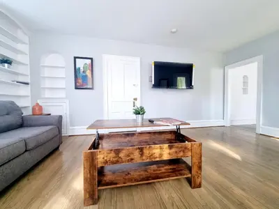 a living room with a couch and a coffee table at 1 Bedroom 1 Bath Apartment In Melrose Park in Elkins Park