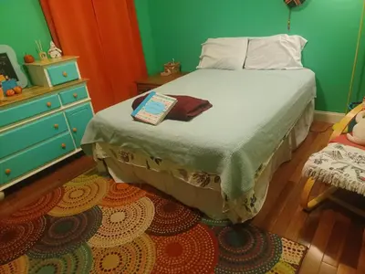 a bedroom with a bed with a book on it at Harvey's Lake/near Rickett's Glen in Harveys Lake