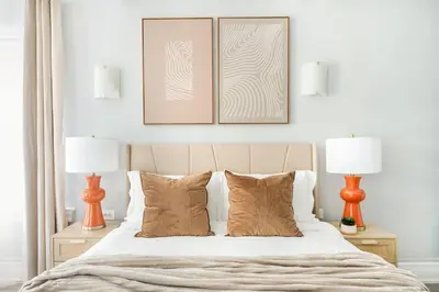 a bedroom with two lamps and a bed with two pillows at 73-1503 Newly Reno Studio UWS Doorman Gym Laundry in New York