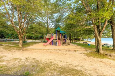 a playground with a slide in a park at 5mi to Big Boulder Hot tub Patio Firepit Fast WiFi in Blakeslee