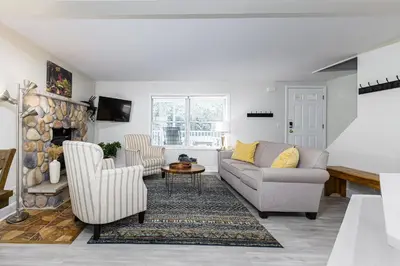 a living room with a couch and two chairs at 5mi to Big Boulder Hot tub Patio Firepit Fast WiFi in Blakeslee