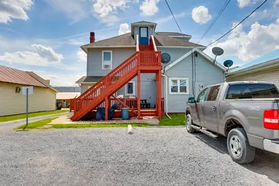 a silver truck parked in front of a house at Loganton Townhome, Near Fly Fishing and Hiking! in Loganton
