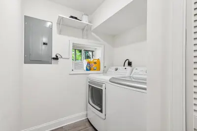 a kitchen with a washing machine and a sink at Family Friendly in the Heart of Mt Airy in Philadelphia