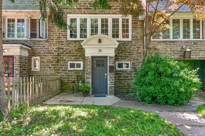 a brick house with a blue door at Family Friendly in the Heart of Mt Airy in Philadelphia