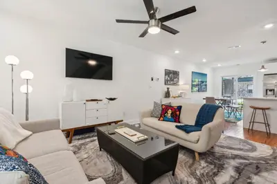 a living room with two couches and a ceiling fan at Family Friendly in the Heart of Mt Airy in Philadelphia
