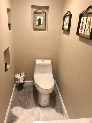 a bathroom with a toilet and a white rug at House in Bucks County in Perkasie