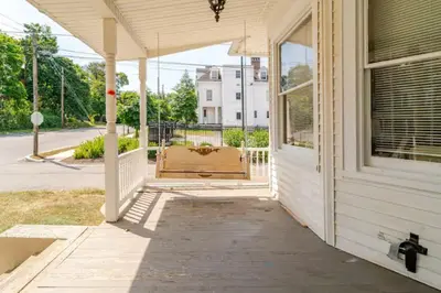 an empty porch of a house with awning at Victorian Home Sleeps 10 Fenced 4BR Full Kitchen Steps2 YCP in York