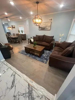 a living room with a couch and a table at Huge Family House 12 miles to NYC4BathParking in Belleville