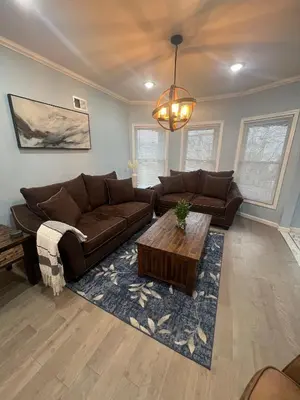 a living room with a couch and a coffee table at Huge Family House 12 miles to NYC4BathParking in Belleville